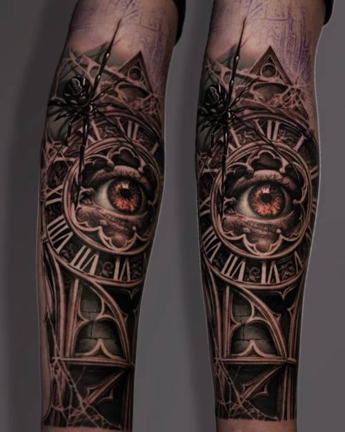 Pocket watch, compass and pyramids, black and grey forearm tattoo