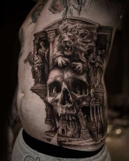 Skull built from ancient ruins and columns, black and grey torso tattoo by Vladimir Kozachenko