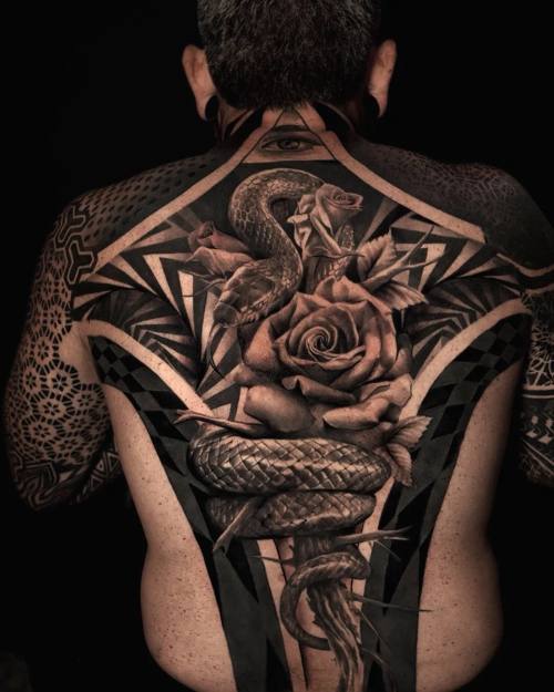 Snake and roses in a geometric blackwork frame, full back tattoo