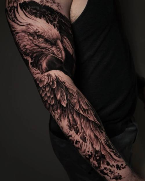 Eagle with spread wings, black and grey realism full sleeve