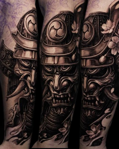Samurai mask and armour with cherry blossom, black and grey arm tattoo by Vladimir Kozachenko