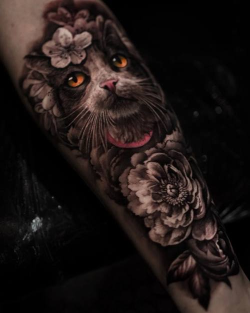 Cat portrait with flowers, black and grey forearm tattoo
